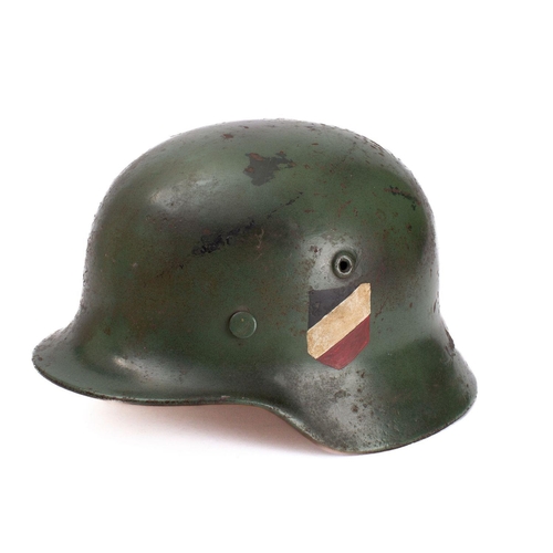 756 - A WWII period M1942 pattern Youth's Stahlhelm  green with National colours to one side and applied r... 