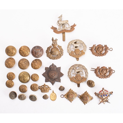 785 - A small collection of Regimental cap badges and buttons,  including  Royal Warwickshire and Hampshir... 