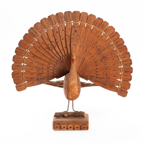 787 - A WWII German POW wooden model of a peacock, 26cm high.