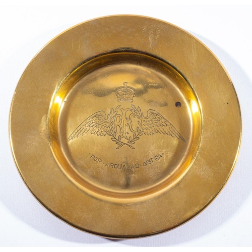 791 - A brass ashtray with Royal Flying Corps insignia, 15 cm diameter.