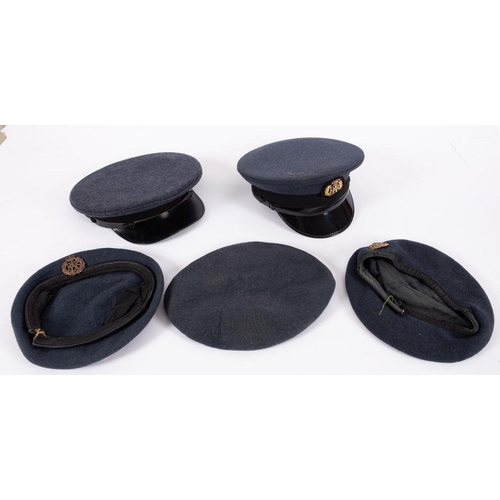 822 - Two post War RAF peaked caps, together with three RAF berets