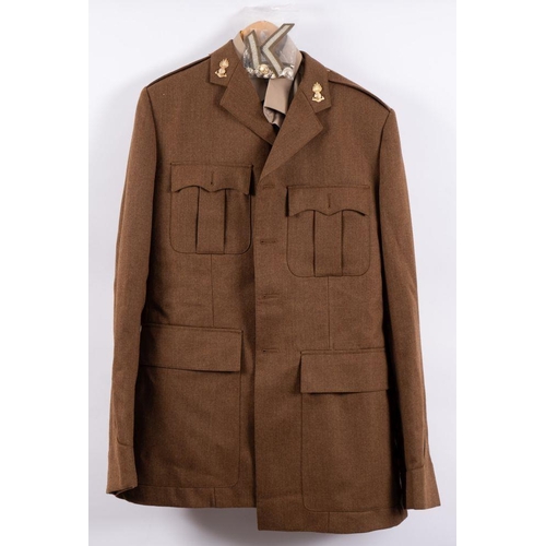 843A - A Royal Artillery Uniform comprising peaked cap  jacket, trousers, shirt and tie, together with a Ro... 