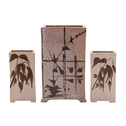 135 - Robert Tinnyunt [b. 1940] a stoneware slab built vase of rectangular form on four short feet decorat... 