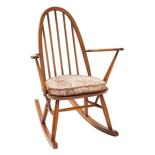 420 - An Ercol elm and beech 'Quaker' rocking chair, early 1980s; with arched spindle back and open arms; ... 