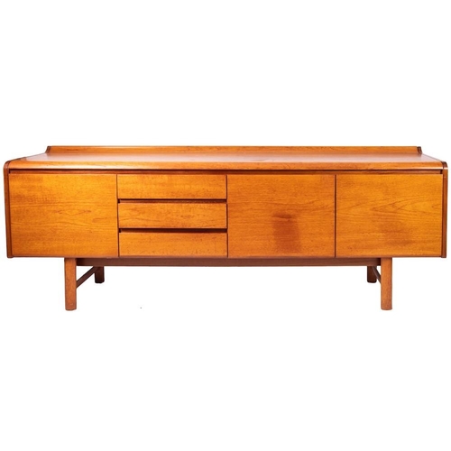 436 - A teak sideboard, circa 1960s; the top with raised back edge and moulded front, above an arrangement... 