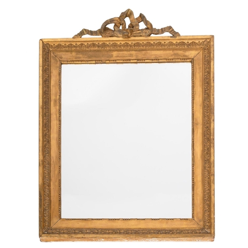 1089 - A giltwood framed rectangular wall mirror, late 19th century; the ribbon tide cresting above bevelle... 