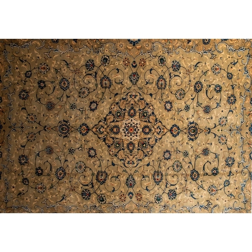 1178 - A Kashan carpet, the pastel grey field with an all over design of palmettes and scrolling floral fol... 