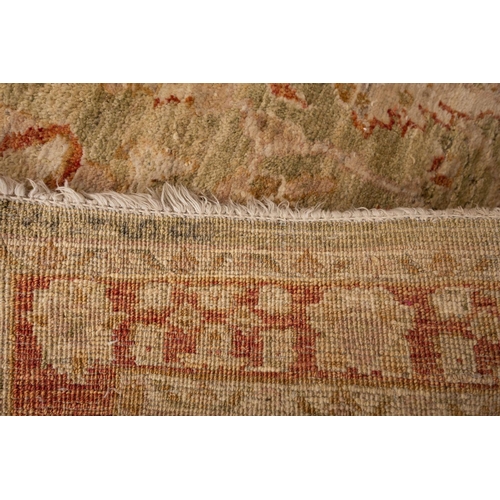 1185 - A Turkish runner, the pistachio field with a repeated design of palmettes, boteh and floral foliate ... 