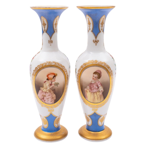 14 - A pair of French opaline glass vases painted with pendant floral sprays and oval panels of young gir... 