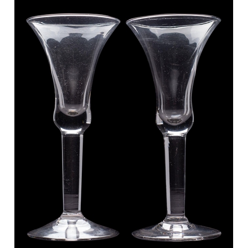 20 - A mixed group of glass, comprising a pair of cut decanters and stoppers, a pair of wine glasses and ... 