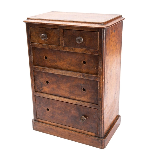 322 - A miniature Victorian walnut chest of drawers, circa 1880; the top with moulded edges, above two sho... 