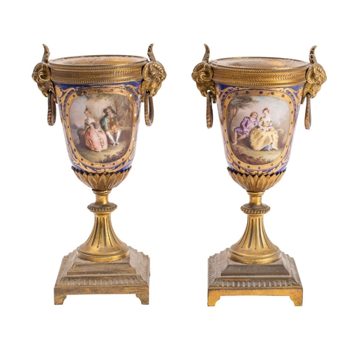 342 - A pair of late 19th century gilt-metal and 'Sevres' porcelain mounted  cassollette bases with goat's... 