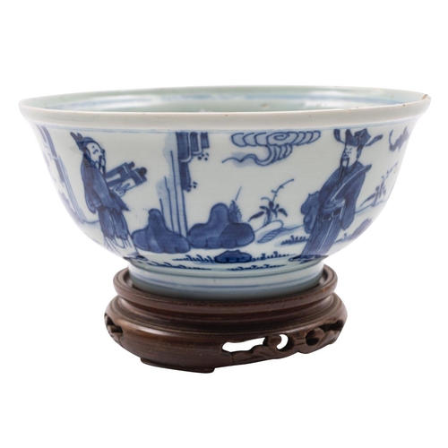 85 - A Chinese blue and white bowl the exterior painted with figures in a garden including an acolyte pre... 