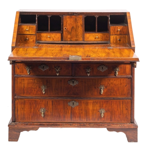 869 - A George I walnut bureau, early 18th century and later; the  rectangular top above a sloping fall fr... 