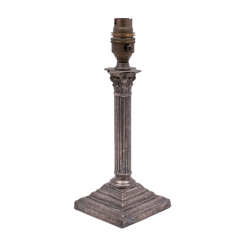 16 - An early 20th century silver plated Corinthian column candlestick table lamp on a stepped square bas... 