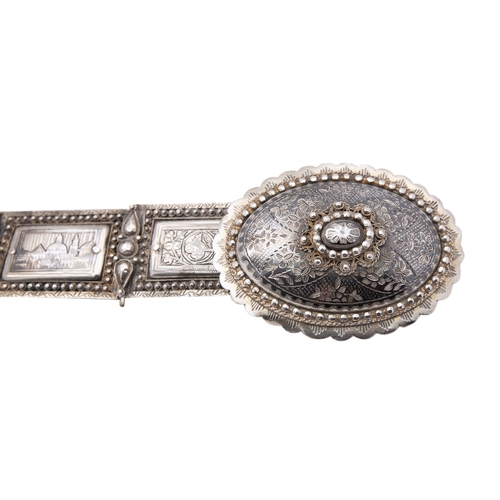 193 - A late 19th century Armenian silver and niello pictorial belt, marked on the buckle, each panel 5 x ... 