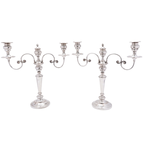 2 - A pair of 19th century Sheffield Plate twin branch candelabra, unmarked set on a stepped tapering st... 