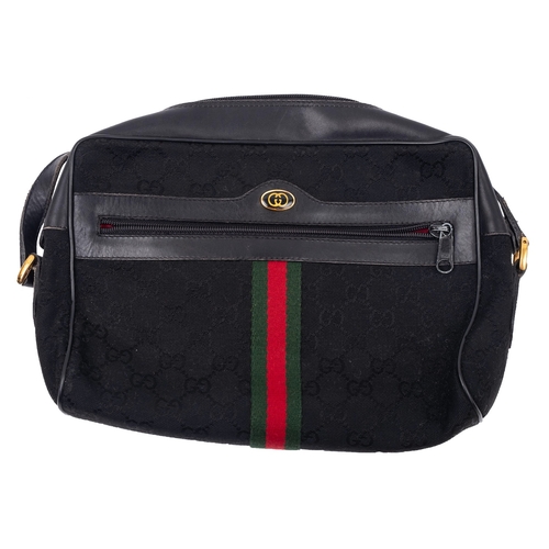 750 - Gucci Anniversary Collection.  A  black leather and  canvas shoulder bag canvas 'GG' body with  red ... 