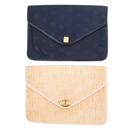 764 - Christian Dior. Two  small clutch bags, one in cream the other in black,  both stamped to interior (... 