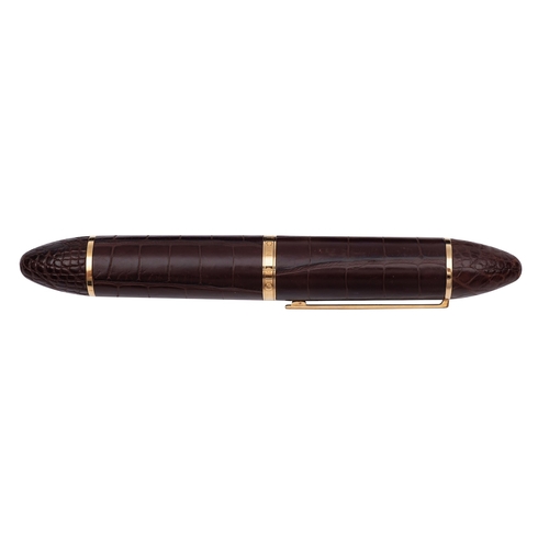 A Louis Vuitton Cargo Exotic brown leather fountain pen, gilt clip and  fittings, with an 18k gold ni