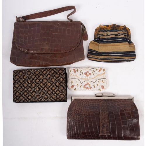 597 - Two leather faux crocodile handbags, a white bead and embroidered purse and two others, (5).