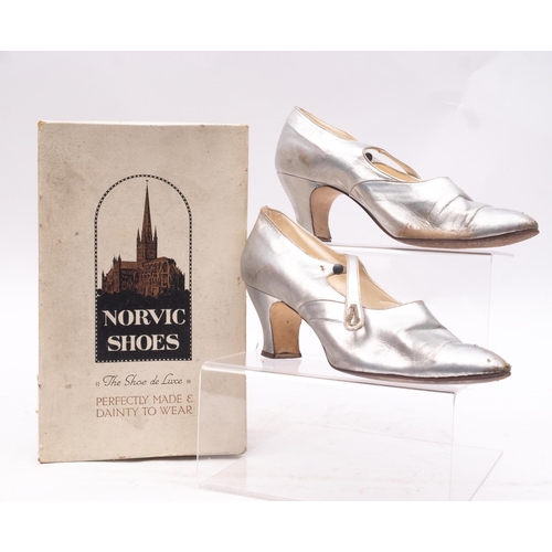 617 - Norvic, Norwich. A pair or early 20th century silver leather lady's shoes, style No, N1312, size 5 1... 