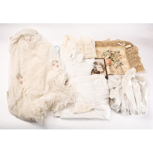 626 - A group of five early 20th century christening gowns, together with a with photograph of child in a ... 