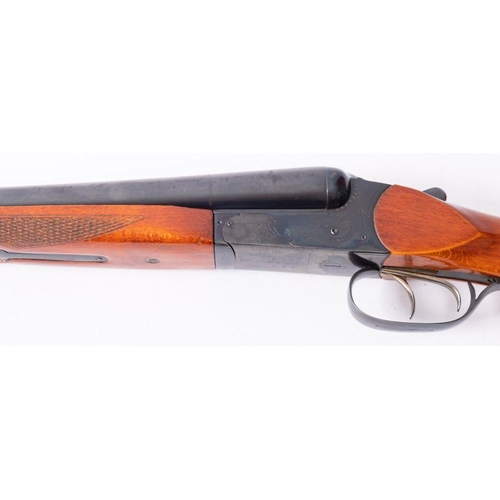 63 - A Baikal 12 bore side by side boxlock shotgun, serial number '23186', double trigger, chequered semi... 