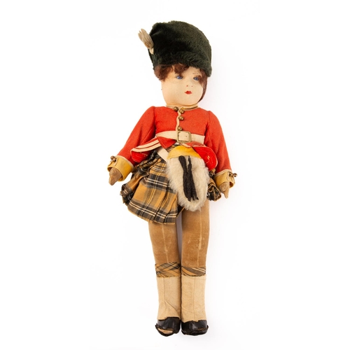 652 - Lenci, Chad Valley or similar. An early 20th century linen head Highland Guardsman doll,  brown hair... 