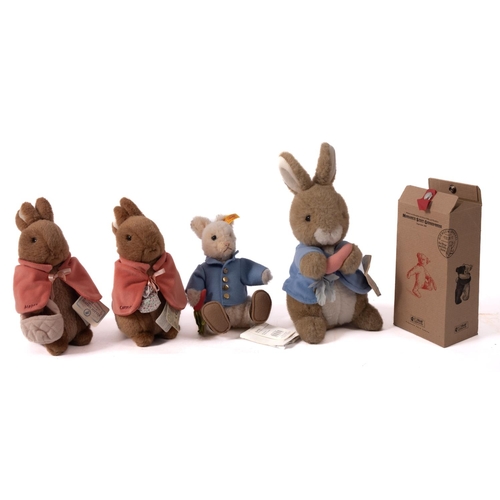 662 - A Steiff plush Peter Rabbit, 20cm high, together with an Eden Peter Rabbit 30cm high and an August d... 