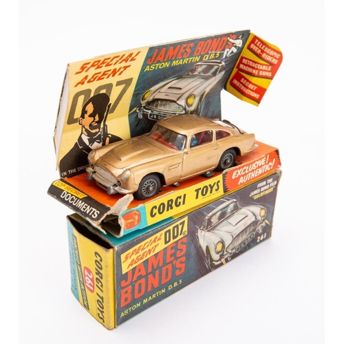 668 - Corgi 261 'James Bond' Aston Martin DB.5 taken from the film 'Goldfinger': gold body, red interior w... 