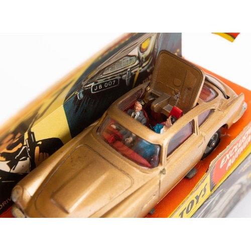 668 - Corgi 261 'James Bond' Aston Martin DB.5 taken from the film 'Goldfinger': gold body, red interior w... 