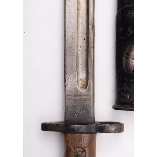 147 - A WWI period British 1907 pattern bayonet, the straight single edge fullered blade with War Departme... 