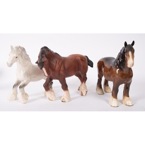 16 - Three Beswick Shire horses, two in gloss and one in matte glaze, the largest 21cm high overall