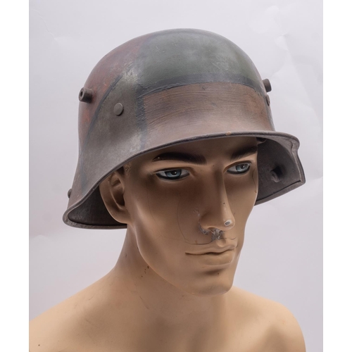 171 - A WWI period German M1916 Stahlhelm, hand painted camouflage finish with brown leather liner, the he... 