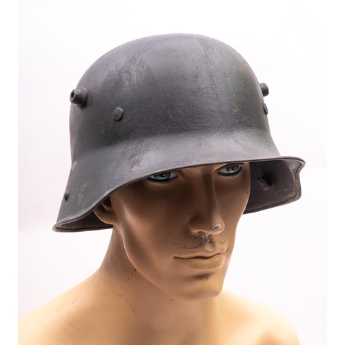 172 - A WWI period German M1916 Stahlhelm, hand painted camouflage finish with white leather liner, the he... 