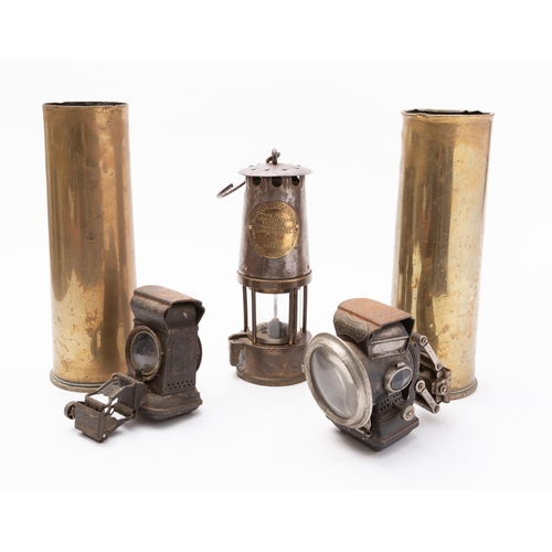 186 - Two World War I shell cases 18 PR II, CF 1915, two bicycle lamps, two oil two tilly lamps with extra... 