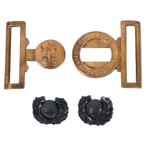 193 - Two WWII Royal Marines Plastic Officer's Cap Badges, together with a Royal Marines waist belt clasp.