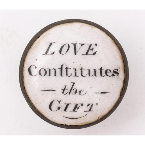 2 - An early 19th century circular enamel patch box 'Love Continues the Gift', black text on white ename... 