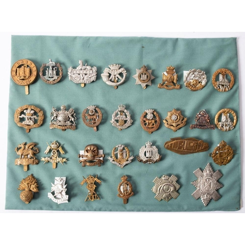 200 - A collection of various regimental cap badges, including Tank Regiment, 9th Lancers, Hampshire Regim... 