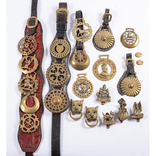 24 - A collection of various horses brasses, together with two Martingales and a small collection of bras... 