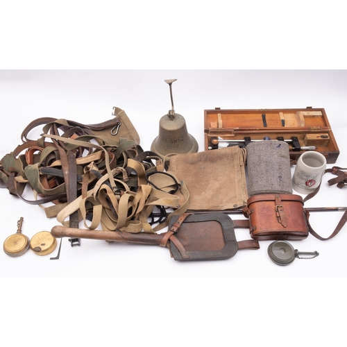 246 - A Collection of various militaria, including a German trench shovel with black leather frog, a swagg... 