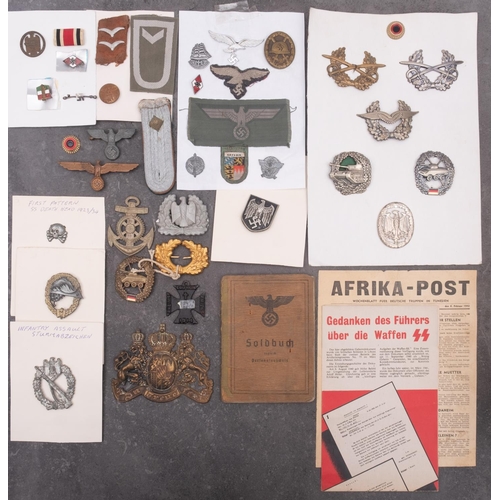 259 - A collection of German Army badges and insignia, (some reproductions).