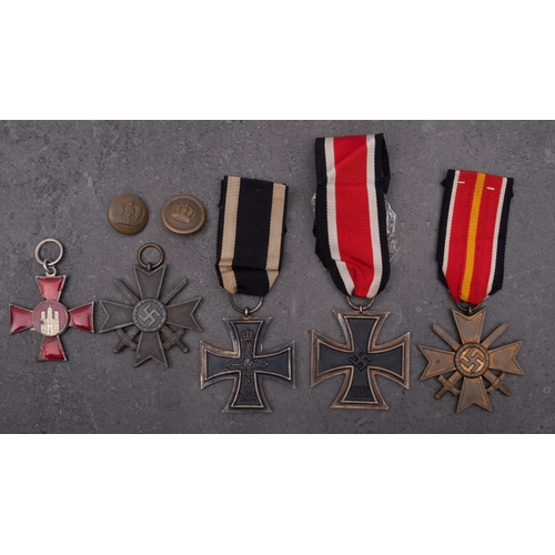 260 - A WWI Iron Cross, together with a Hanseatic Cross, two War Merit Crosses and a reproduction Iron Cro... 