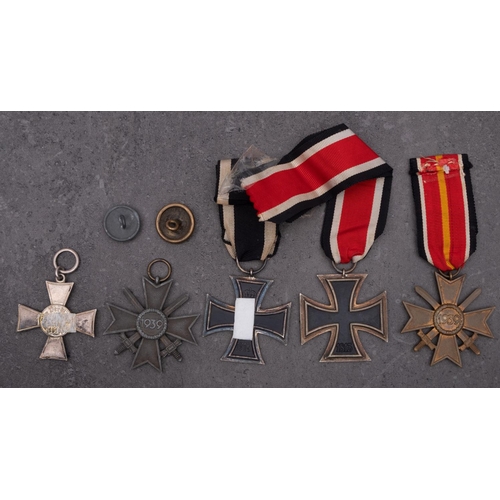 260 - A WWI Iron Cross, together with a Hanseatic Cross, two War Merit Crosses and a reproduction Iron Cro... 