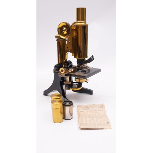 276 - A late 19th/early 20th century lacquered brass microscope, maker James Swift & Son , London, serial ... 