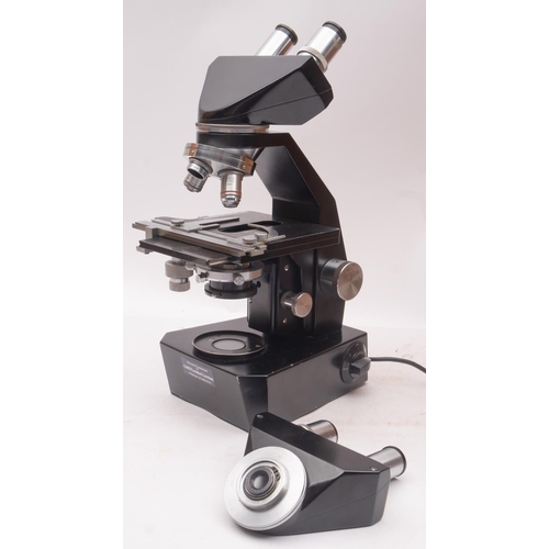 279 - Gillett & Sibert. A cased binocular microscope, serial number M11801,  with triple objectives over a... 