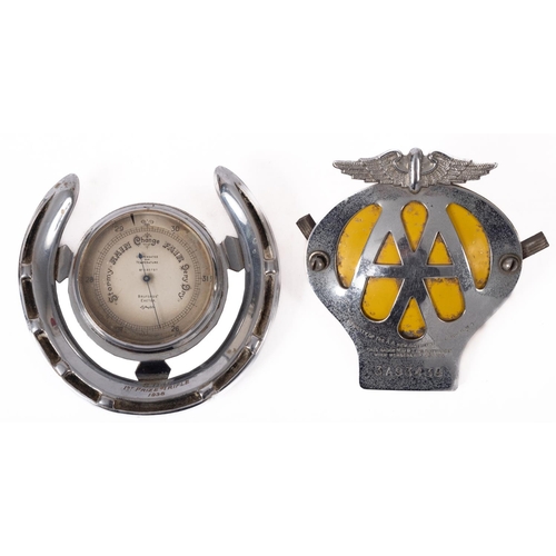 33 - A silver plated horseshoe mounted Aneroid barometer, the silvered vernier dial numbered K.65737 and ... 