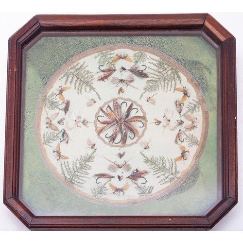 340 - A late 19th century framed display of gut eyed flies,  the central wheel of Salmon flies surrounded ... 