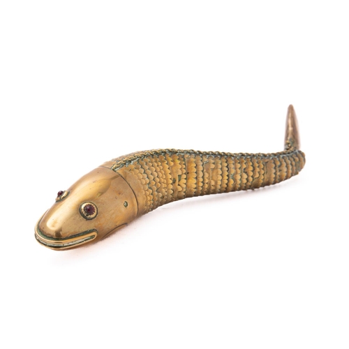 349 - An early 20th century articulated brass fish with red glass eyes, 23.5cm long.